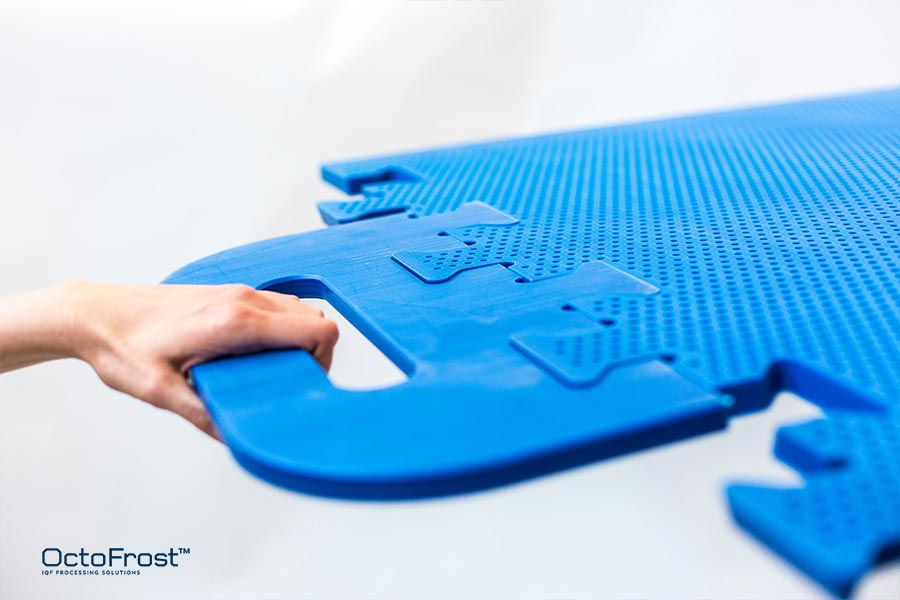 close up of perforated octofrost blue bedplates being pulled